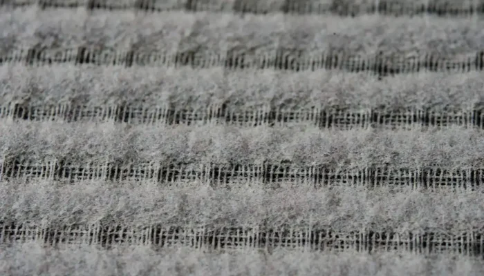 ac-repair-brownsville-tx-dirty-filter.jpg Close-up texture of a heavily clogged HVAC furnace filter covered in thick dust before an ac repair brownsville tx duct cleaning service.